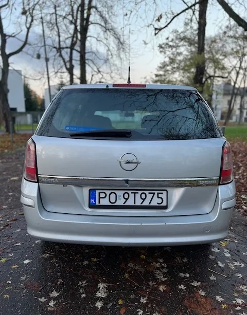 Opel Astra cena 11900 przebieg: 297000, rok produkcji 2012 z Poznań małe 254